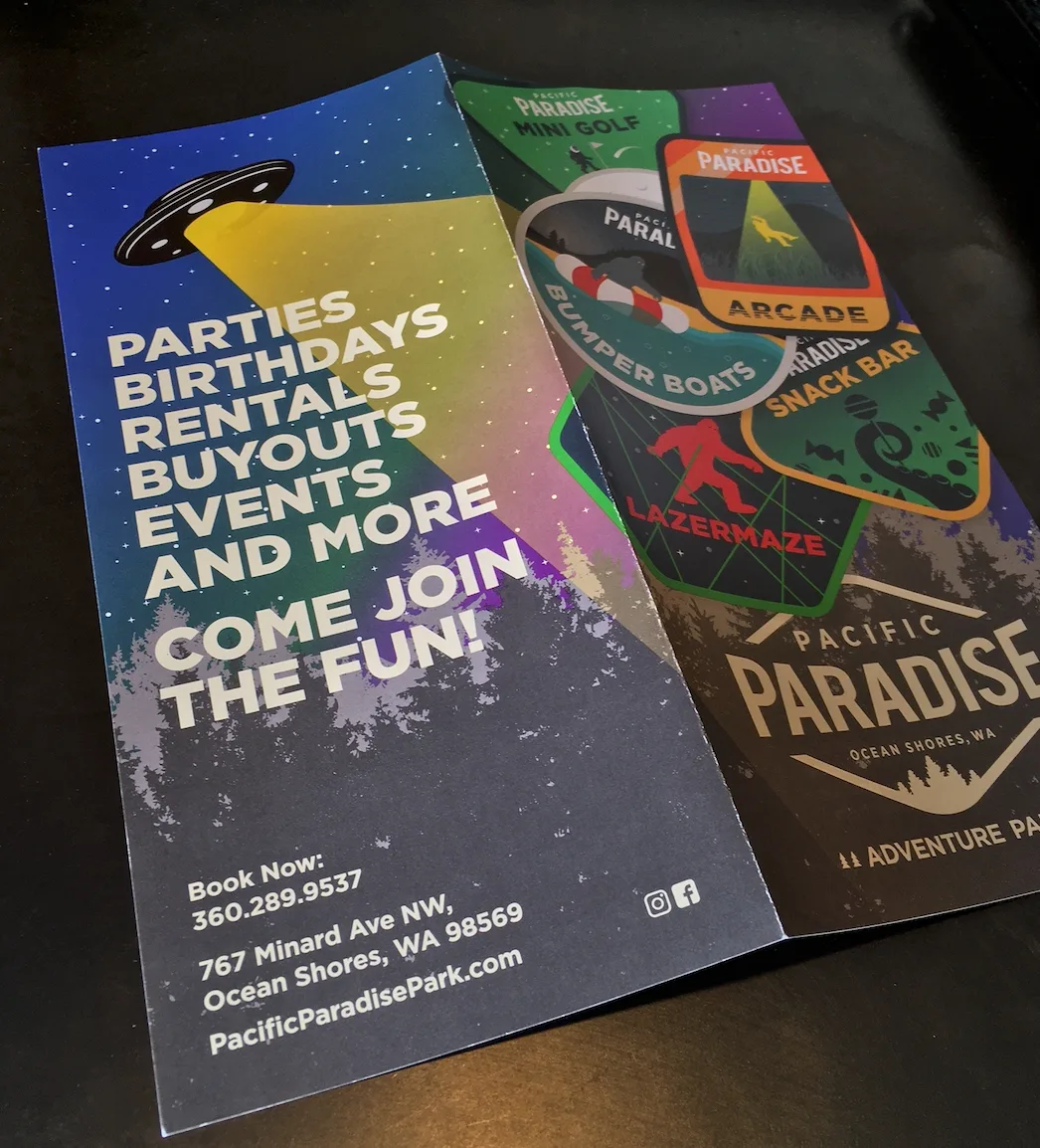 Pacific Paradise trifold brochure cover with a UFO graphic and party, birthday, and event booking details