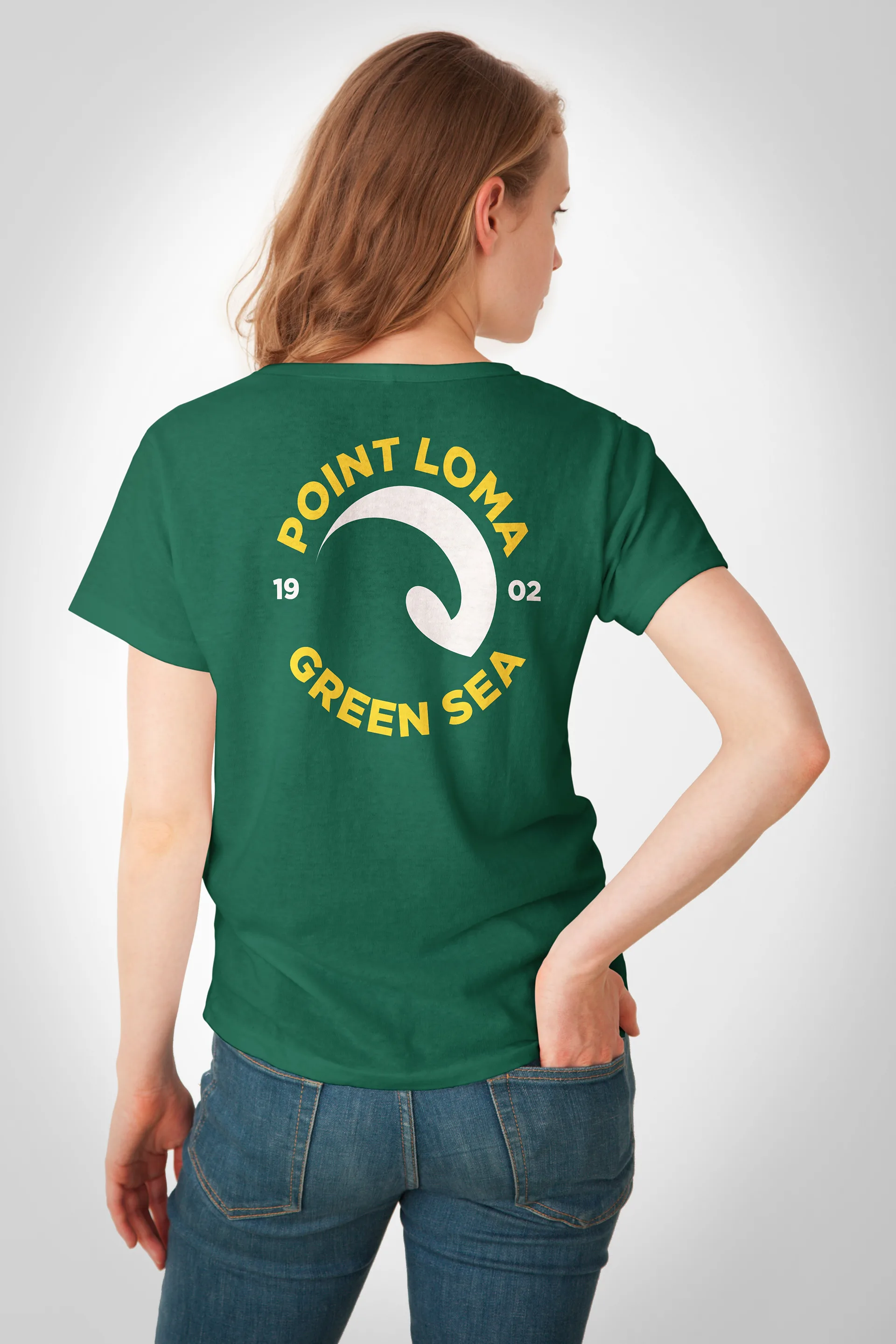 Back view of a model wearing a green t-shirt printed with the Point Loma Green Sea wave logo and 1902
