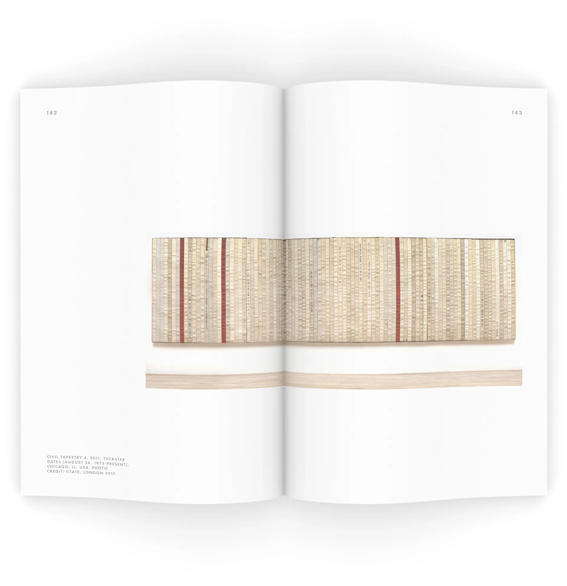 Book spread showing a photograph of Theaster Gates' woven fire-hose artwork Civil Tapestry 4 spanning both pages