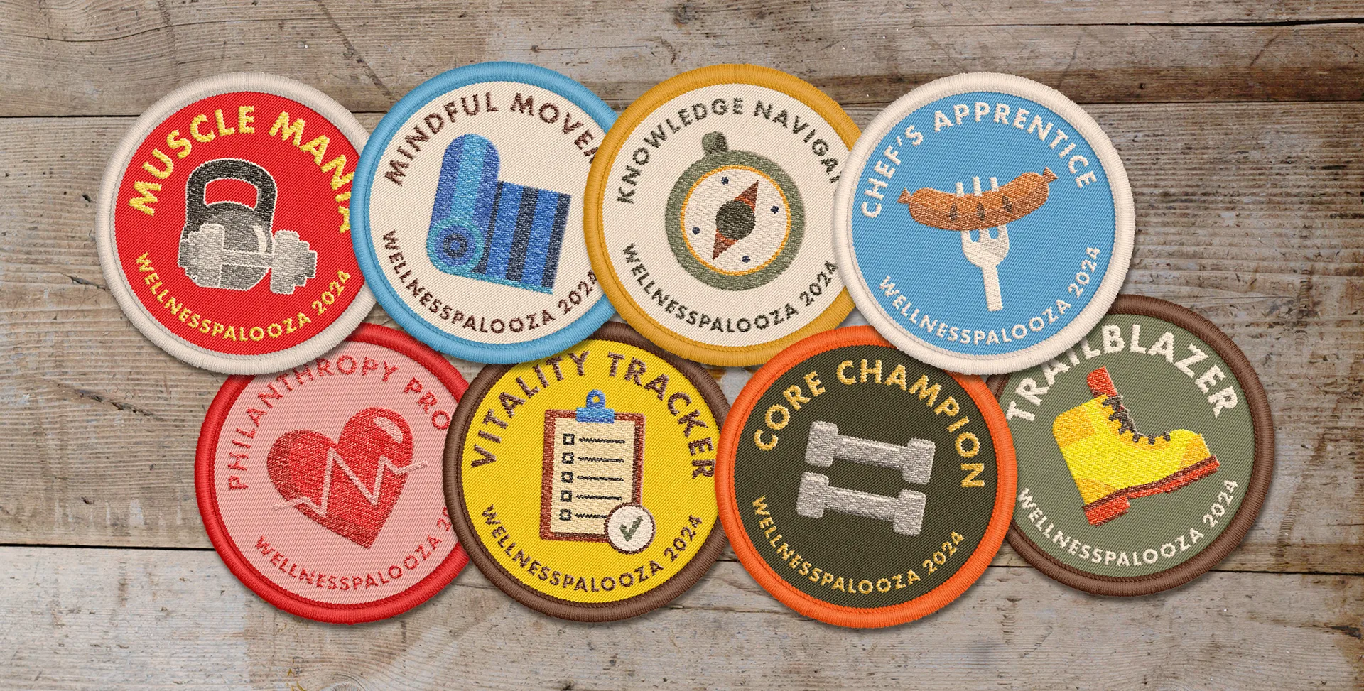 Eight embroidered-style circular patches on a wood background, each naming a WellnessPalooza 2024 activity team like Muscle Mania and Trailblazer