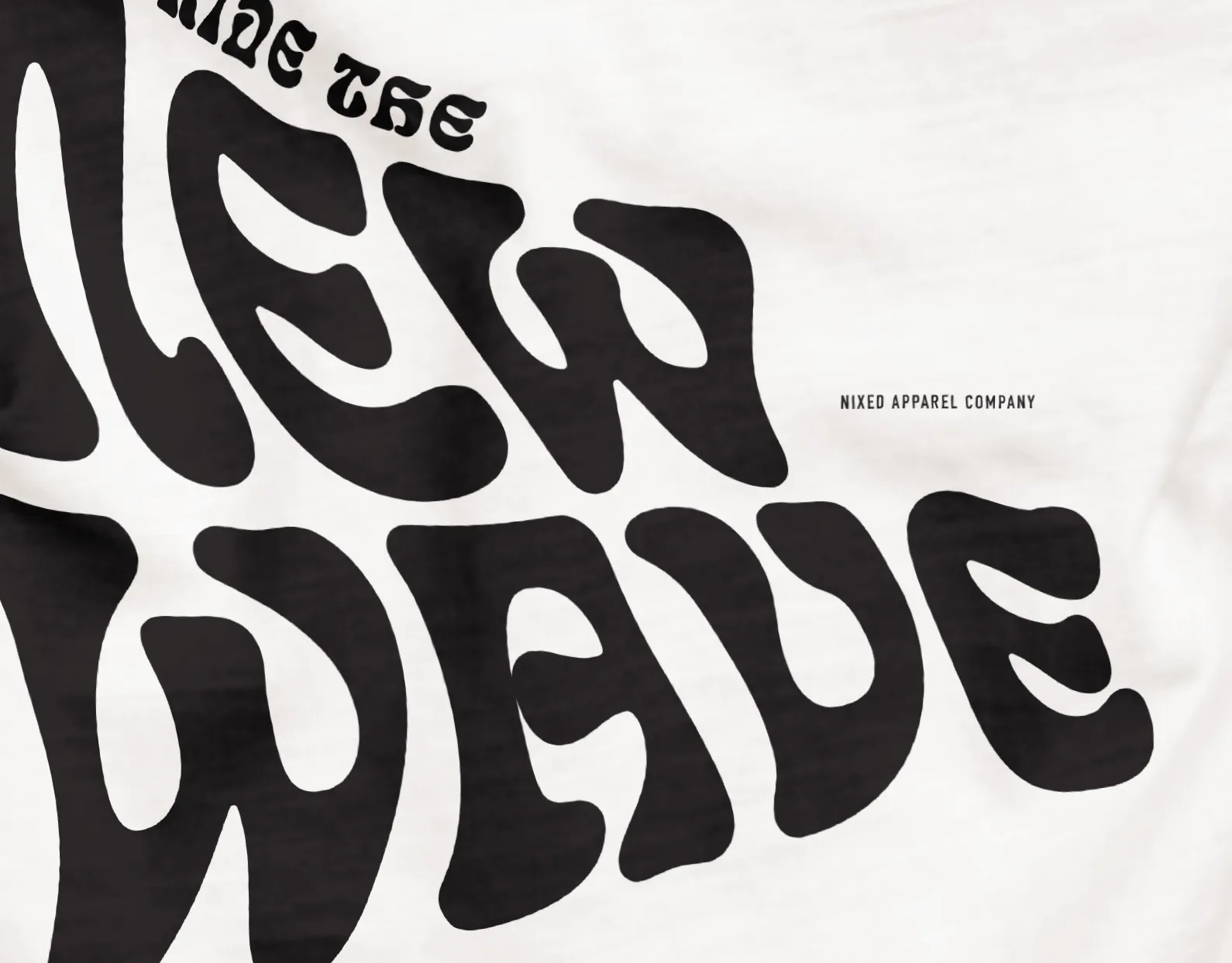 NIXED Apparel Company cover: white t-shirt close-up with bold wavy Ride the New Wave lettering and the brand logo