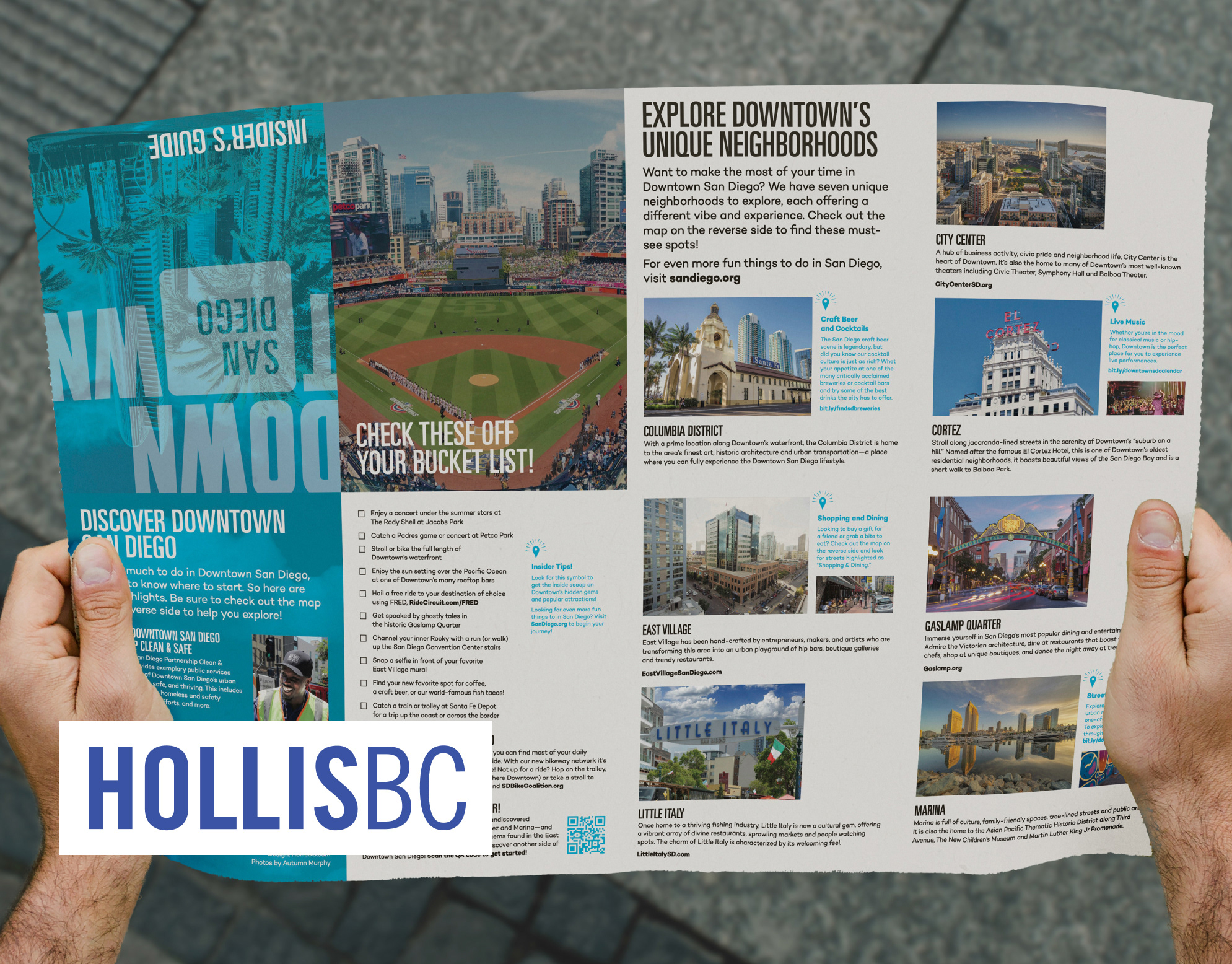 Downtown San Diego Insider's Guide cover: hands holding the folded brochure showing downtown neighborhoods and a bucket-list checklist